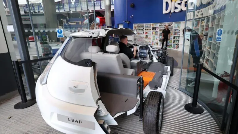 The Nissan LEAF car cross-section was driven through the front door of the museum in preparation for the exhibit